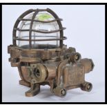 A  20th century Industrial heavy / extreme duty pendant bulkhead lamp light having a caged glass