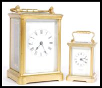 Two 20th Century brass cased carriage clocks both having white enamelled faces with roman numerals