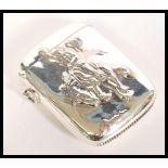 A sterling silver vesta case having embossed decoration in relief of a cowboy riding a horse. Weight