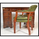 An antique Georgian style mahogany twin pedestal office desk having pedestals, each with banks of