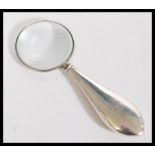 An early 20th century silver hallmarked small magnifying glass by Henry Matthews. Hallmarked for