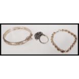 A group of silver hallmarked jewellery to include a bangle bracelet, rope twist bracelet and
