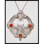 A silver hallmarked pendant necklace having a round silver pendant with Scottish Celtic design set