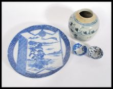 A 19th century Japanese blue and white hand painted charger plate along with two 19th century