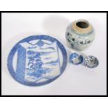 A 19th century Japanese blue and white hand painted charger plate along with two 19th century