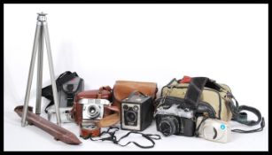 A collection of vintage cameras to include a Fujica ST605N film camera with a 55mm lens, a Balda