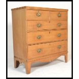 A 19th century Victorian oak chest of drawers being raised on French kick legs with a