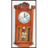 A 20th Century walnut cased regulator wall clock, eight day movement with silver dial and Roman