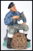 A Royal Doulton ceramic figurine entitled The Lobster Man HN2317 modelled on a naturalistic base