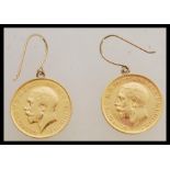 A pair of Edwardian half sovereign earrings. Total