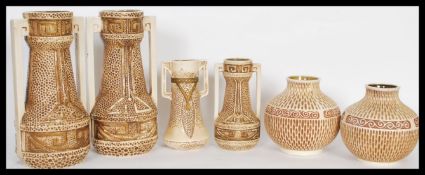 A collection of Bretby 19th / early 20th Century Clanta pattern ceramics in a light cream glaze to