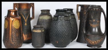 A selection of late 19th Century / early 20th Century Bretby Clanta ceramics having a bronze