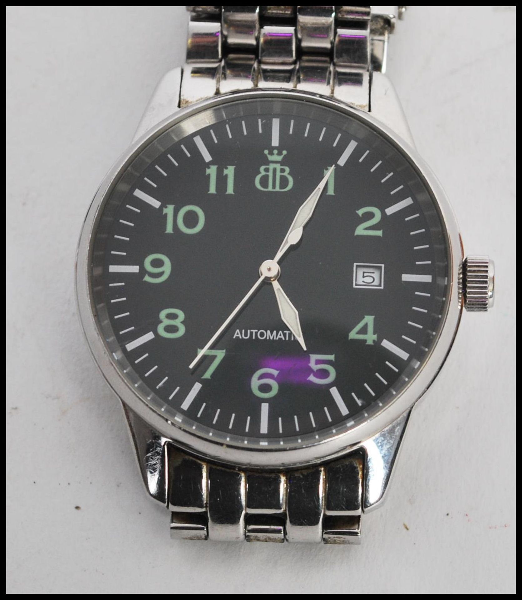 A Brooks and Bentley military style gentleman's wrist watch, black face with illuminous numerals,