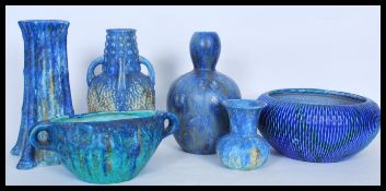 A collection of Bretby 1930's ceramics having a mottled blue and green drip glaze to include a