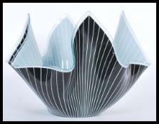 A 20th Century retro Italian style handkerchief form glass bowl having a black ground with white