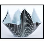 A 20th Century retro Italian style handkerchief form glass bowl having a black ground with white