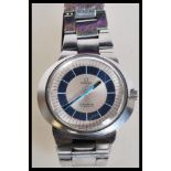 A vintage Omega Geneve Dynamic gentleman's wrist watch having a silvered dial with a blue chapter