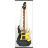 A vintage Ibanez Gio / Gio Ibanez Stratocaster style six string electric guitar having a black