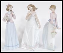A set of three Lladro ceramic figurines comprising of Basket of Love 07622, Innocence in Bloom 07644