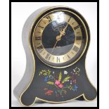An early 20th Century Petite Neuchateloise balloon mantel clock for Jaeger, in black and gold