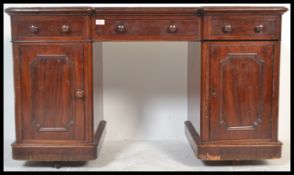 A 19th Century Victorian mahogany inverted twin pedestal breakfront desk, three drawers over two