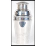 A vintage early 20th Century silver plated Art Deco cocktail shaker of stepped conical form. Stamped