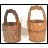 A pair of 19th Century French coopered wooden and iron bound dairy / well buckets having wrought