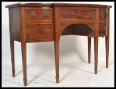A 19th Century Georgian  mahogany satin wood banded serpentine front sideboard fitted cupboards