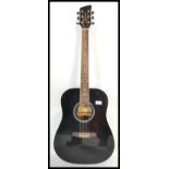 A vintage Brunswick six string acoustic guitar model BD200BK. The shaped hollow body having ebonised