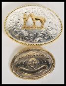 Two vintage 20th Century silver white metal large oversized belt buckles one of oval form with