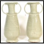 A large pair of 19th Century Celadon crackle glaze floor standing vases of tapering bulbous form