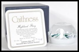 A rare 20th Century Caithness Scotland Glass millefiori paperweight entitled Highland Fling designed