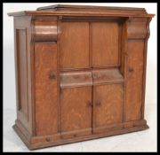 A stunning late 19th century Victorian  oak cased treadle Singer sewing machine cabinet, the cabinet