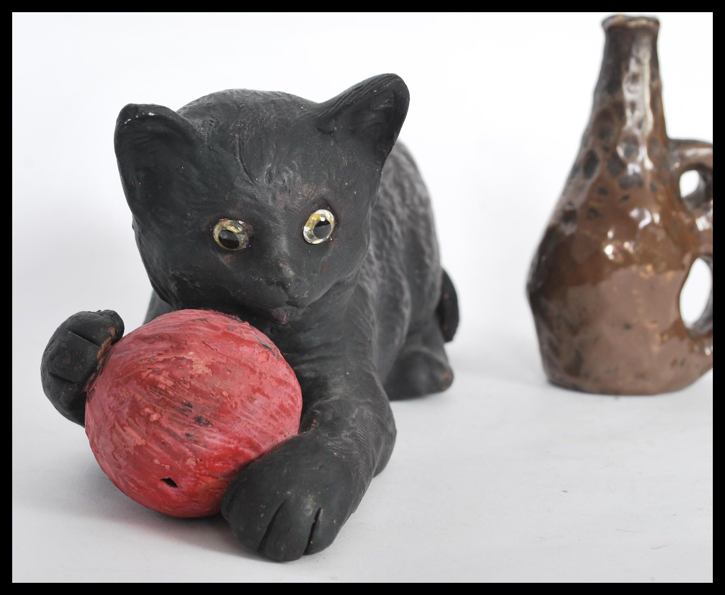 A Bretby figurine in the form of a cat with a ball of pink yarn no. 1618 and a smaller art pottery - Image 2 of 4