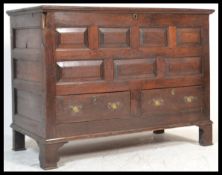 A large 18th century country oak mule chest coffer. Raised on stile legs with a two short drawers