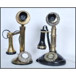 A pair of vintage style brass and bakelite stick telephones, both raised on circular bases with