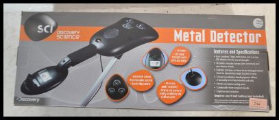 A boxed metal detector by Discovery Science, battery operated with instructions within original