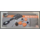 A boxed metal detector by Discovery Science, battery operated with instructions within original