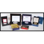 A group of cased proof coins to include a Westminster Numis Proof Baroness Thatcher coin, Coronation