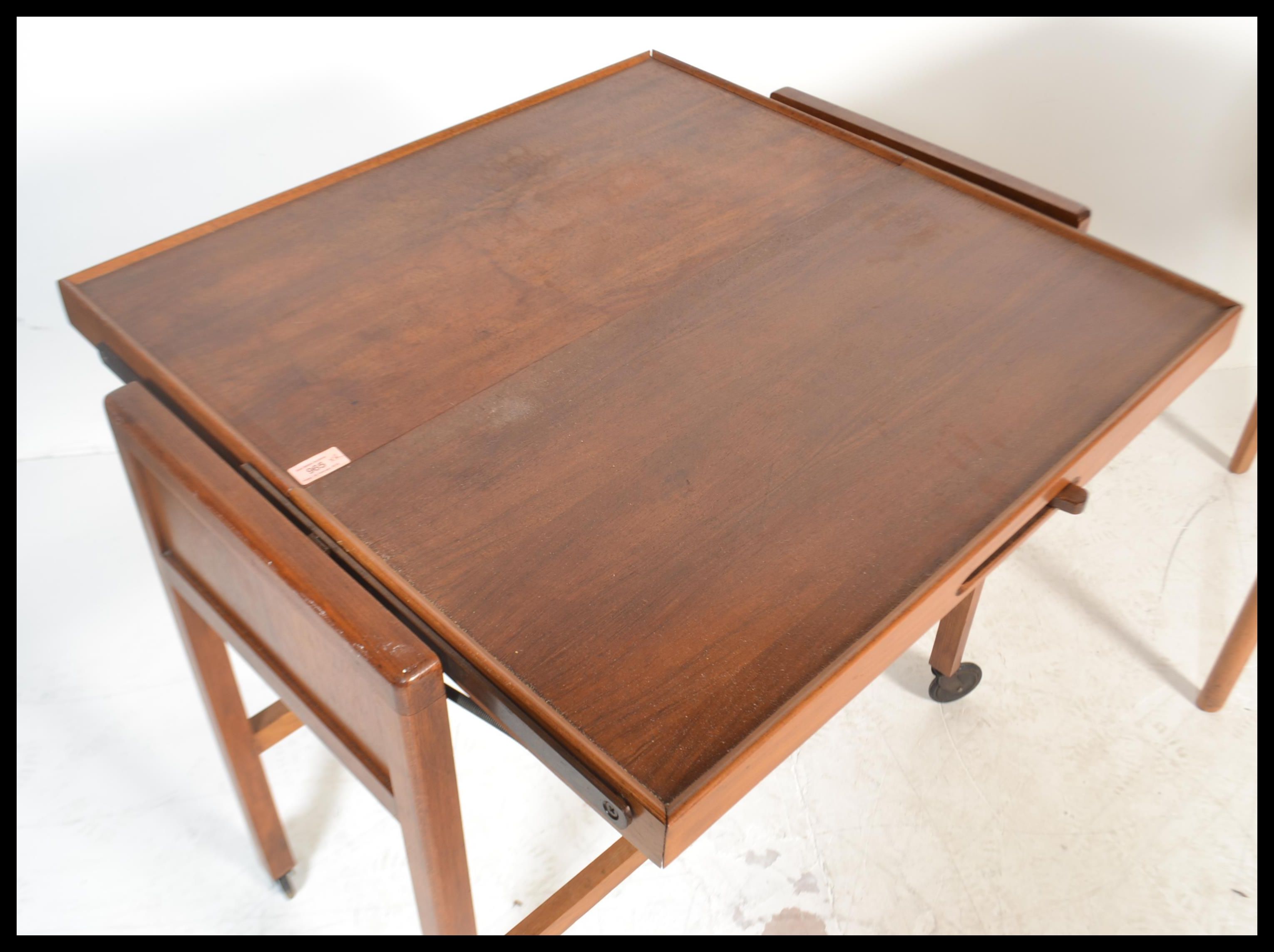 A vintage mid 20th Century teak wood metamorphic buffet trolley raised on square supports on castors - Image 7 of 7
