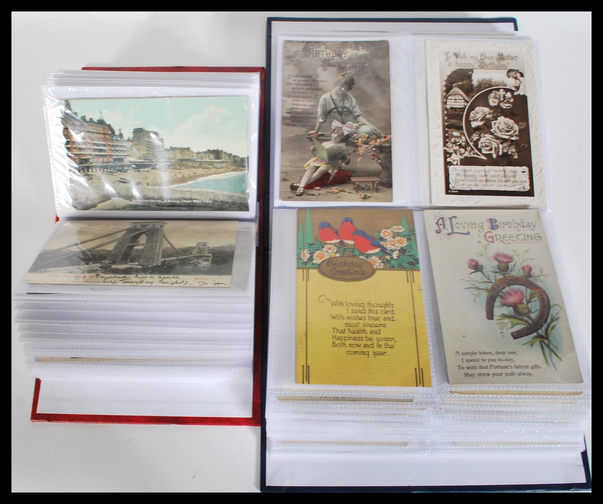 Two albums of vintage postcards dating from the early 20th Century including many examples of