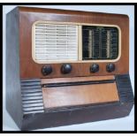 A vintage Regentone Multi 99 Auto Table Radiogram set within a veneered case of rectangular form