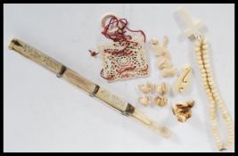 A 19th Century collection of antique ivory items to include crucifix rosary bead necklace, ivory