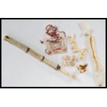 A 19th Century collection of antique ivory items to include crucifix rosary bead necklace, ivory