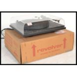 A retro 20th Century Revolver record deck turntable, clear perspex lid,with a Goldring G1010