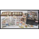 A shoebox of vintage cigarette cards mostly part sets and odds to include Wills, Players, Ogdens,