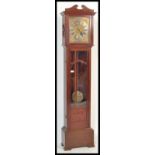 An early to mid 20th Century mahogany cased long case / grandfather clock, brass face with Roman