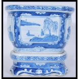 A late 19th / early 20th Century Chinese blue and white jardiniere planter on stand having hand