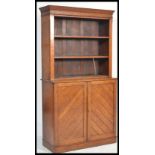 A late 19th Victorian arts and crafts oak bookcase having an open window bookcase with flared