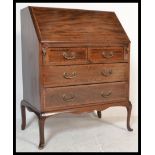 An early 20th Century Edwardian mahogany boxwood inlay bureau raised on cabriole legs. Two over